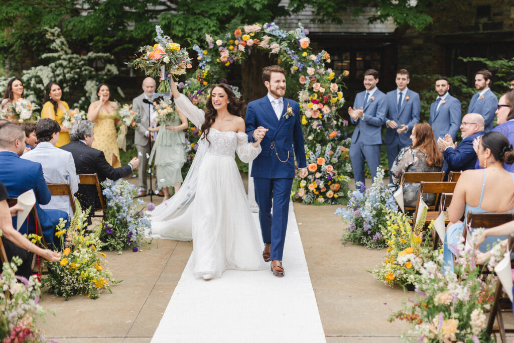 Colorful spring wedding ceremony arch at Blue Hill at Stone Barns, Long Island NY Florist